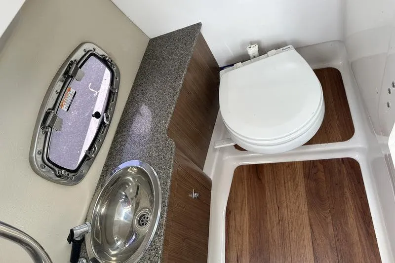 Slide: The Image of Interior of 2015 Chaparral 257 SSX boat bathroom with sink and toilet. - 5