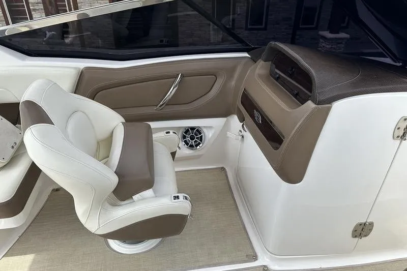 Slide: The Image of Interior of 2015 Chaparral 257 SSX boat featuring helm and seating area. - 6
