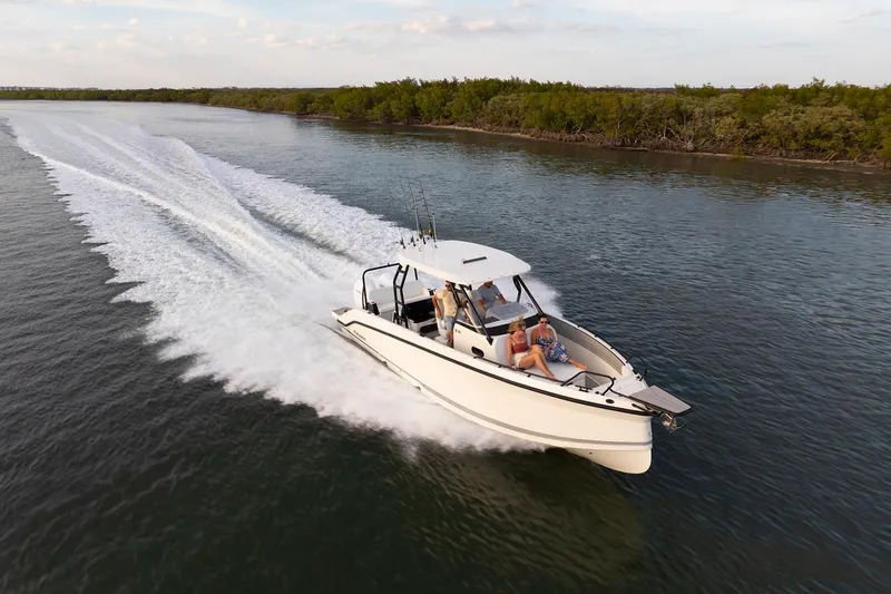 The Image of Navan T30 boat cruising on a scenic waterway, 2027 model, with passengers enjoying the ride. - 0