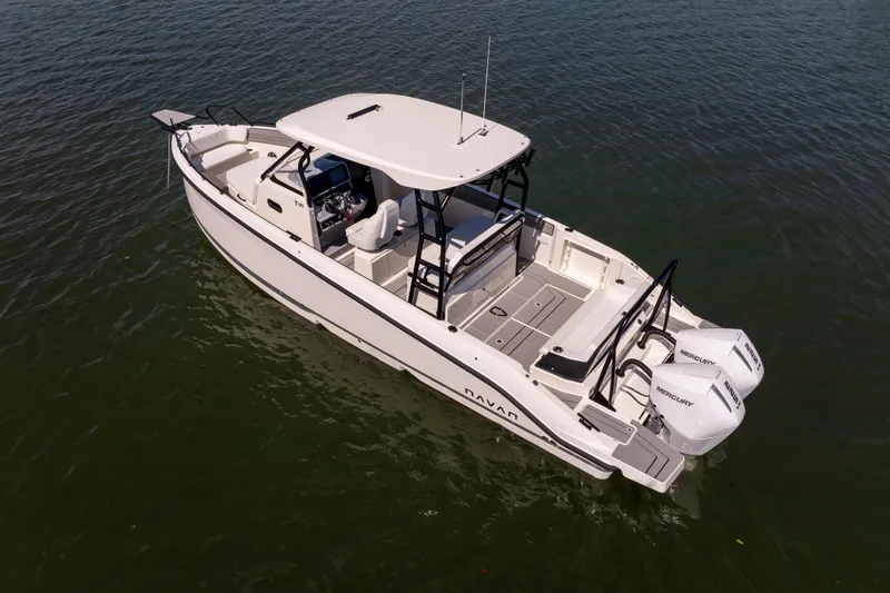 Slide: The Image of Navan T30 2027 boat on water, featuring sleek design and dual Mercury engines. - 4
