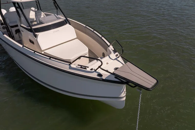 Slide: The Image of Navan T30 2027 boat with sleek design, anchored on calm water. - 5