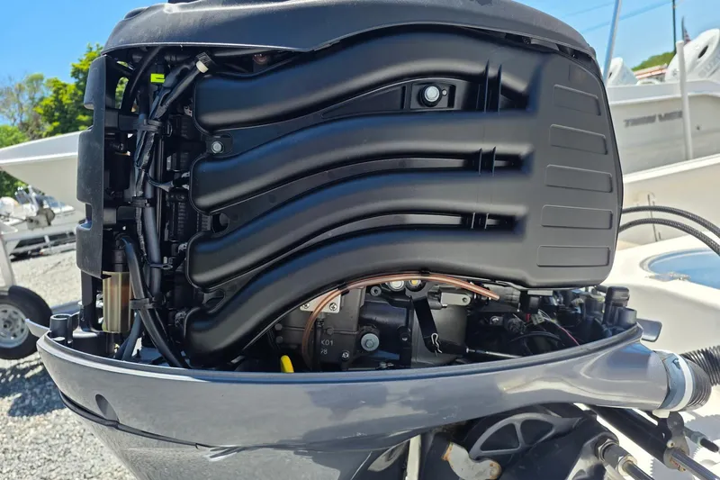 Slide: The Image of Close-up of a 2018 Tidewater 1910 Bay Max boat engine, showcasing intricate mechanical details. - 11