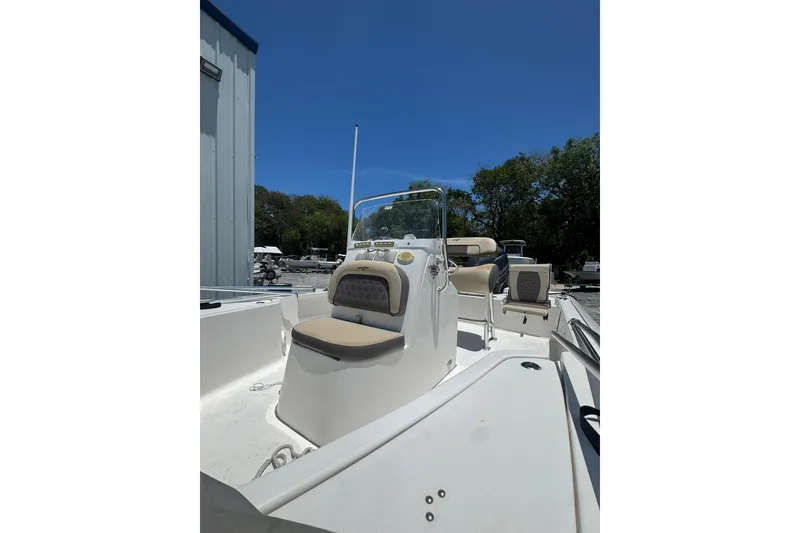 Slide: The Image of 2018 Tidewater 1910 Bay Max boat with beige seating, parked outdoors. - 3