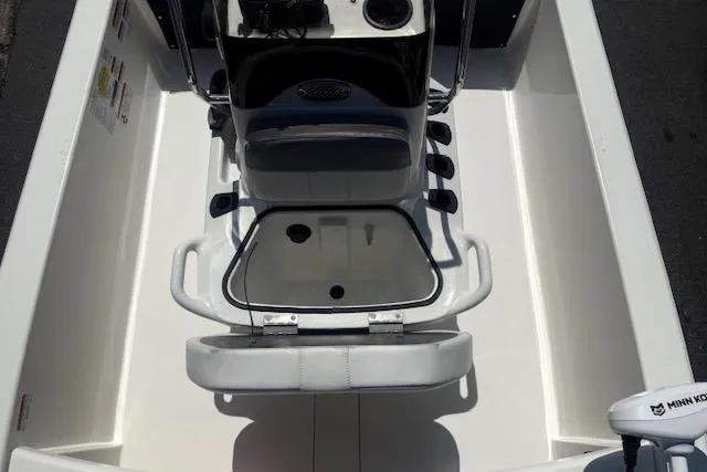 Slide: The Image of 2024 Mako Pro Skiff 13 CC interior with console and seating. - 5