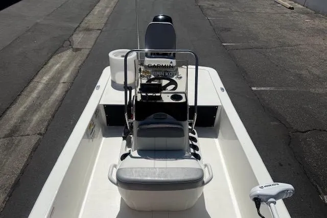 Slide: The Image of 2024 Mako Pro Skiff 13 CC boat with center console and seating, viewed from above. - 9