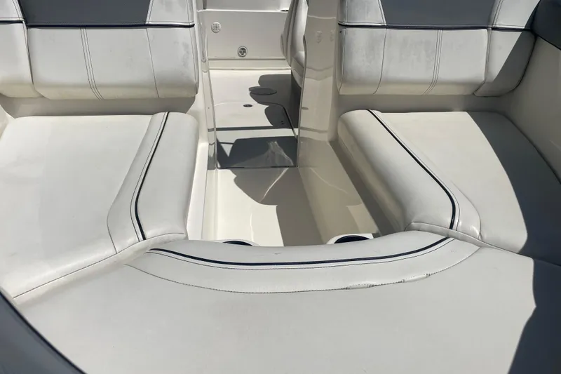 Slide: The Image of 2015 Bayliner 185 Bowrider interior with white cushioned seating. - 7