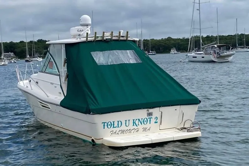 Slide: The Image of 2001 Pursuit 3000 Express boat named "Told U Knot 2" in Falmouth harbor. - 3