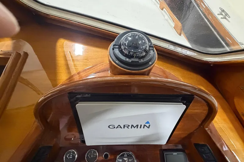 Slide: The Image of Hinckley Picnic Boat 36 EP 2003 dashboard with Garmin navigation and compass. - 5