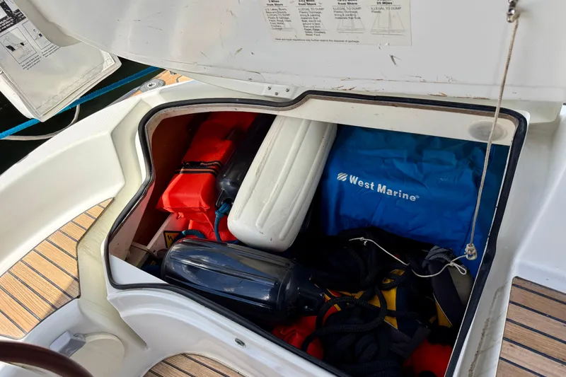 Slide: The Image of Storage compartment of 2004 Jeanneau Sun Odyssey 35 sailboat with marine gear. - 12