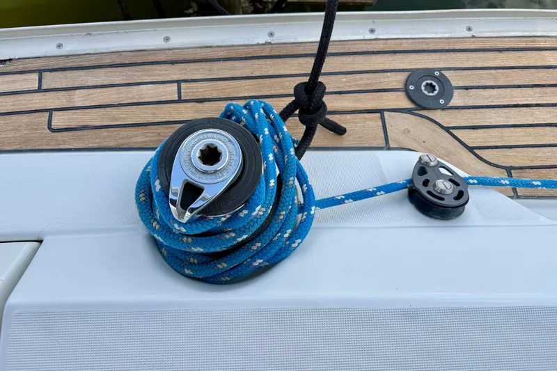Slide: The Image of Winch and blue rope on Jeanneau Sun Odyssey 35 sailboat deck, 2004 model. - 13