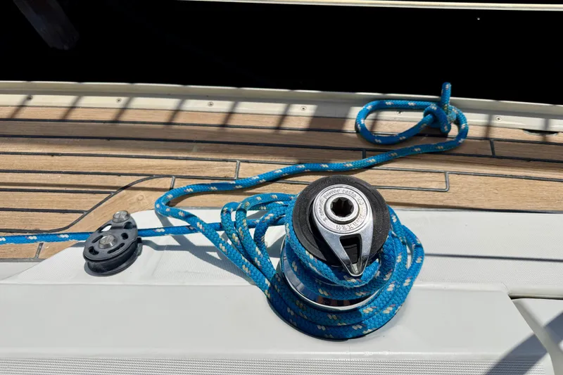 Slide: The Image of Deck of 2004 Jeanneau Sun Odyssey 35 with winch and blue rope. - 15