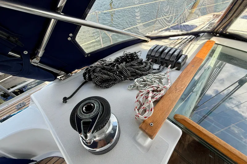 Slide: The Image of Deck view of 2004 Jeanneau Sun Odyssey 35 sailboat with ropes and winch. - 21