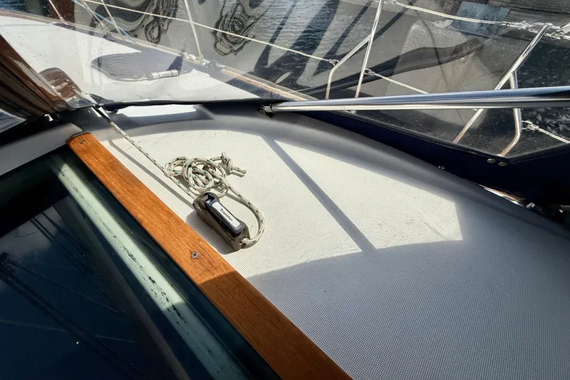 Slide: The Image of Deck view of 2004 Jeanneau Sun Odyssey 35 sailboat with rope and winch. - 23