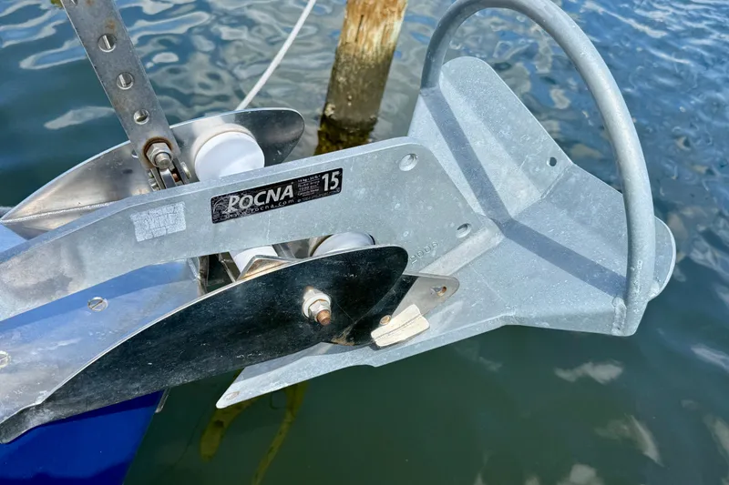 Slide: The Image of Rocna 15 anchor on Jeanneau Sun Odyssey 35, 2004 model, docked by water. - 32