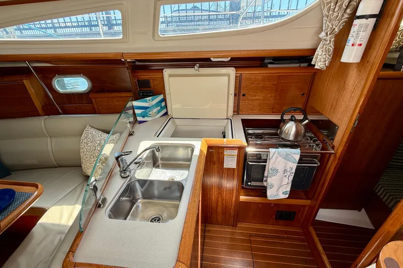 Slide: The Image of Interior of 2004 Jeanneau Sun Odyssey 35 yacht kitchen with sink and stove. - 47