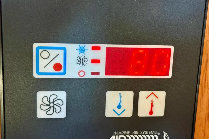 Slide: The Image of Control panel of a 2004 Jeanneau Sun Odyssey 35, displaying temperature settings. - 55
