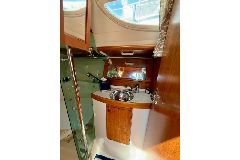 Slide: The Image of Interior of 2004 Jeanneau Sun Odyssey 35 yacht bathroom with sink and mirror. - 58