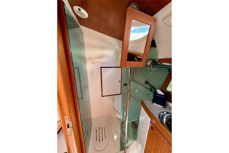 Slide: The Image of Interior of 2004 Jeanneau Sun Odyssey 35 yacht bathroom with mirror and sink. - 59