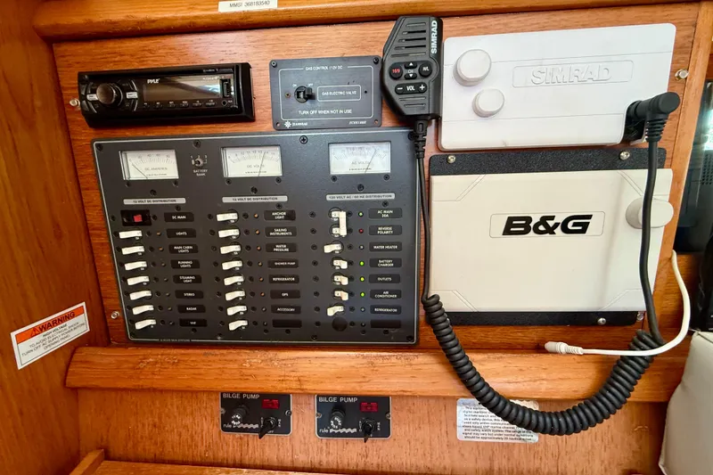 Slide: The Image of Control panel of a 2004 Jeanneau Sun Odyssey 35 sailboat with navigation and electrical systems. - 65