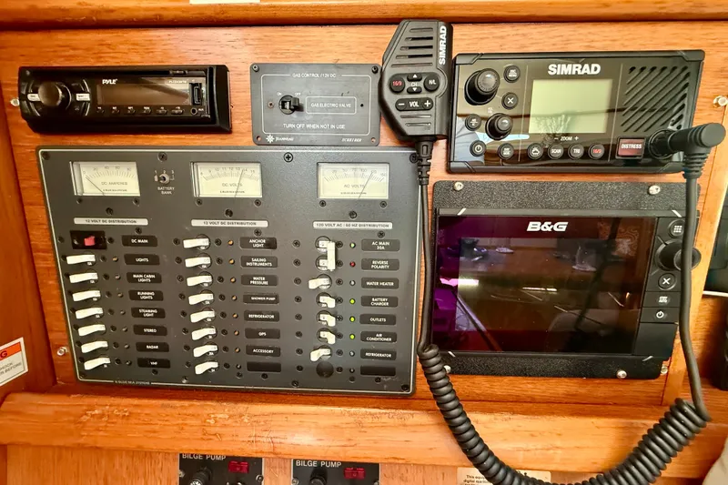 Slide: The Image of Control panel of a 2004 Jeanneau Sun Odyssey 35 sailboat with navigation and communication equipment. - 66