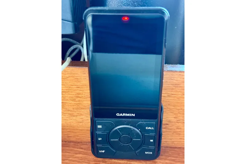 Slide: The Image of Garmin marine radio on Jeanneau Sun Odyssey 35, 2004 model, with wooden background. - 69