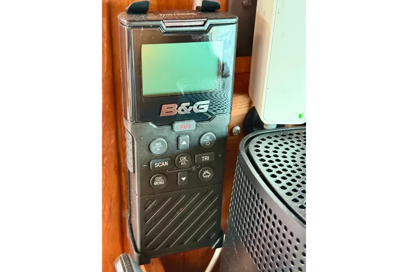 Slide: The Image of B&G marine radio on Jeanneau Sun Odyssey 35, 2004 model, mounted on wooden panel. - 70