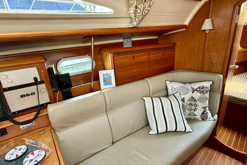 Slide: The Image of Interior of 2004 Jeanneau Sun Odyssey 35 yacht with cozy seating and nautical decor. - 71