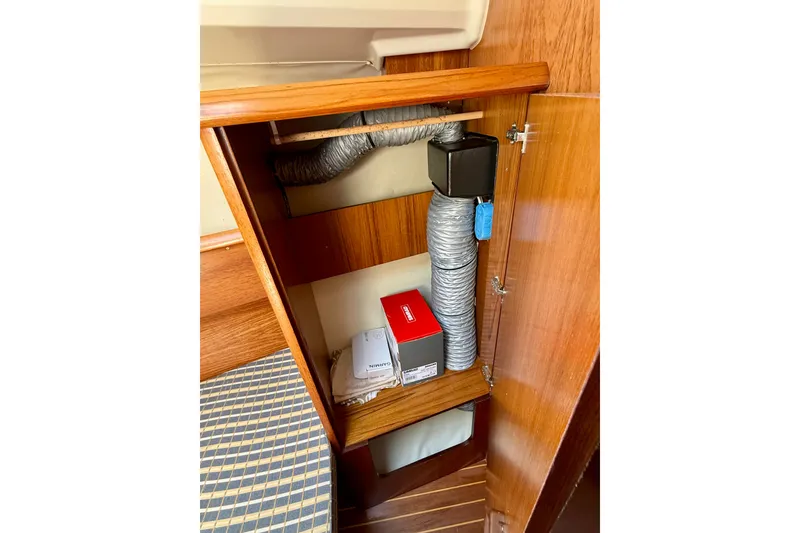 Slide: The Image of Interior storage compartment of 2004 Jeanneau Sun Odyssey 35 sailboat. - 74