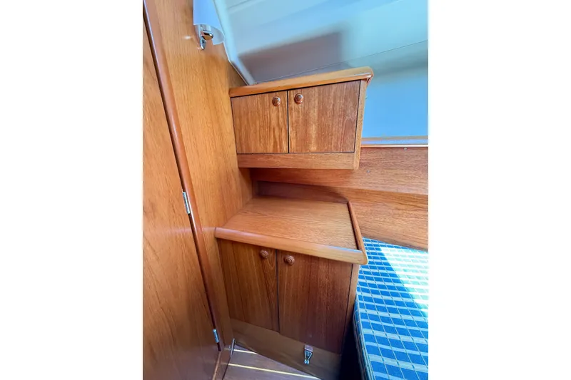 Slide: The Image of Interior wooden cabinetry of 2004 Jeanneau Sun Odyssey 35 sailboat. - 75