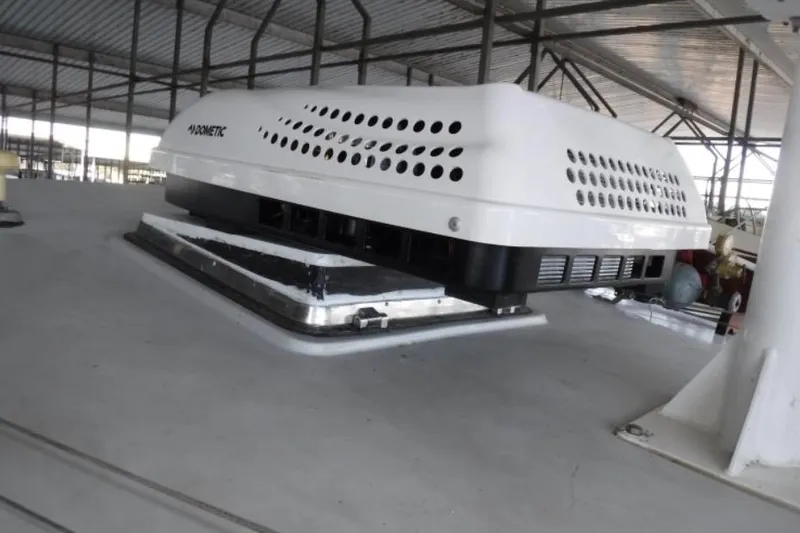 Slide: The Image of Air conditioning unit on 1987 Lord Nelson Victory Tug boat deck in a covered marina. - 12