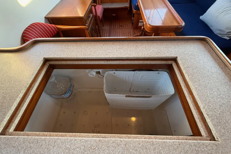 Slide: The Image of Interior of 1987 Lord Nelson Victory Tug with open storage compartment. - 29