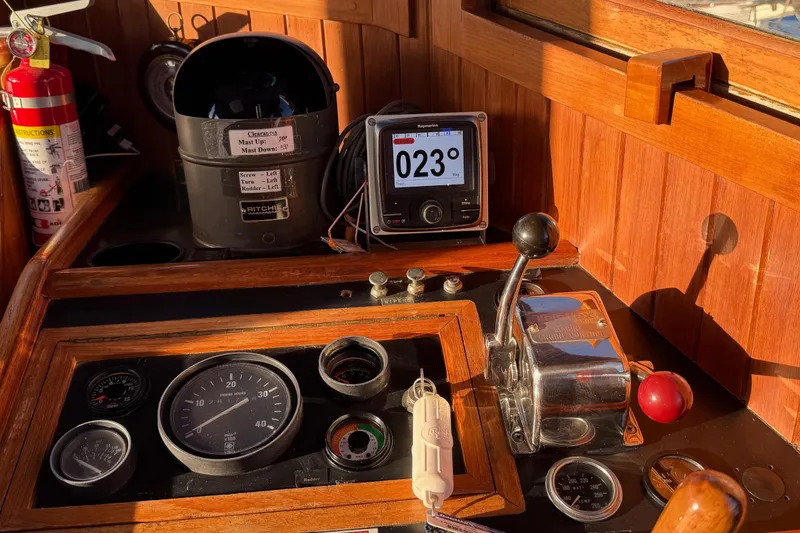 Slide: The Image of 1987 Lord Nelson Victory Tug helm with navigation instruments and controls. - 36