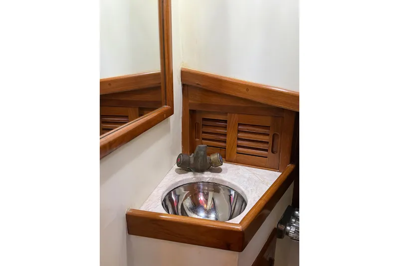 Slide: The Image of Wood-trimmed bathroom sink on 1987 Lord Nelson Victory Tug boat. - 39