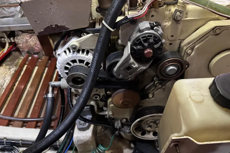 Slide: The Image of Engine components of a 1987 Lord Nelson Victory Tug, showcasing belts and pulleys. - 46