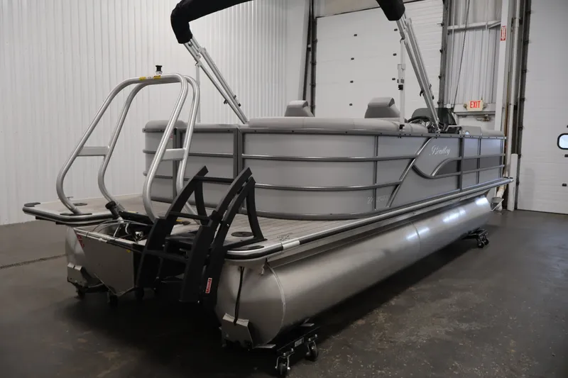 Slide: The Image of 2026 Bentley Pontoons 220 Navigator in a showroom, showcasing sleek design and modern features. - 7