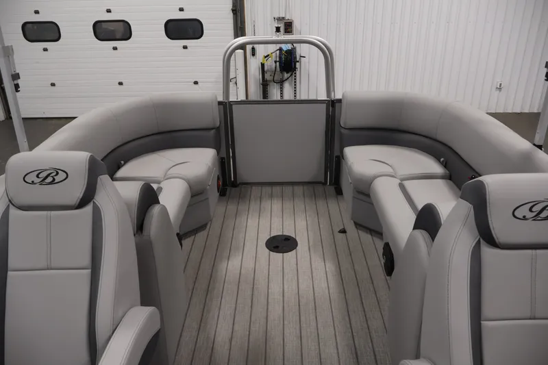 Slide: The Image of 2026 Bentley Pontoons 220 Navigator interior with luxurious gray seating and spacious layout. - 31