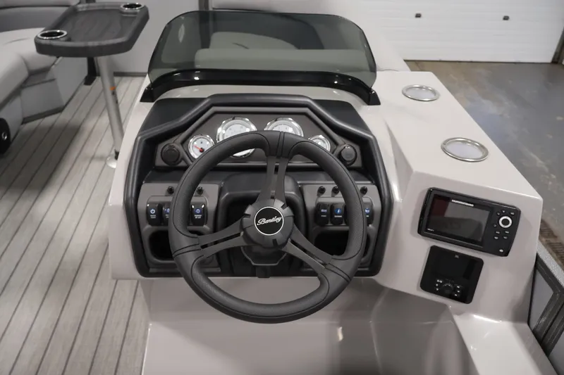 Slide: The Image of Steering console of 2026 Bentley Pontoons 220 Navigator with modern controls and gauges. - 21