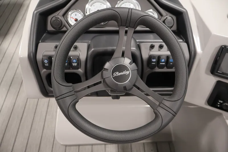 Slide: The Image of Steering wheel of 2026 Bentley Pontoons 220 Navigator with dashboard controls. - 22