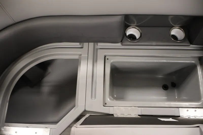 Slide: The Image of Interior view of 2026 Bentley Pontoons 220 Navigator, featuring storage compartments and cup holders. - 34
