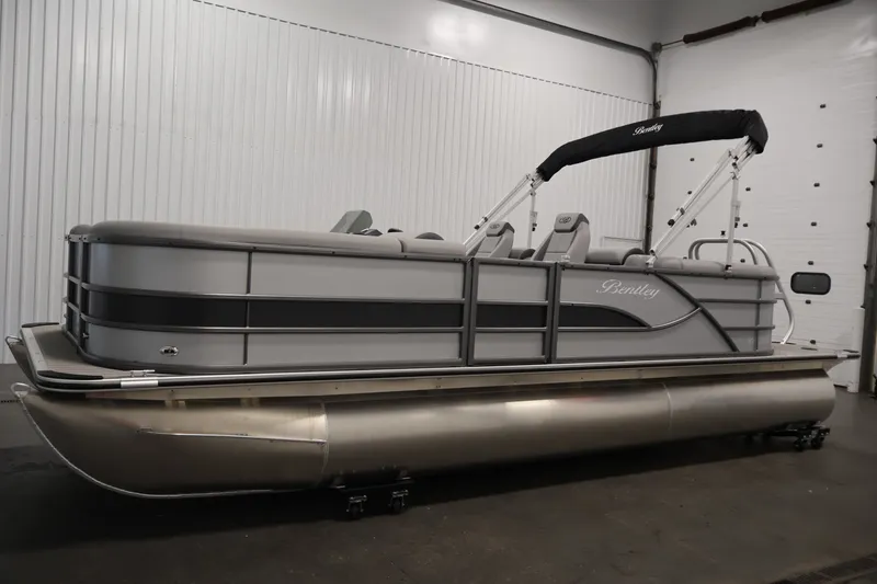 Slide: The Image of 2026 Bentley Pontoons 220 Navigator pontoon boat in a showroom setting. - 10