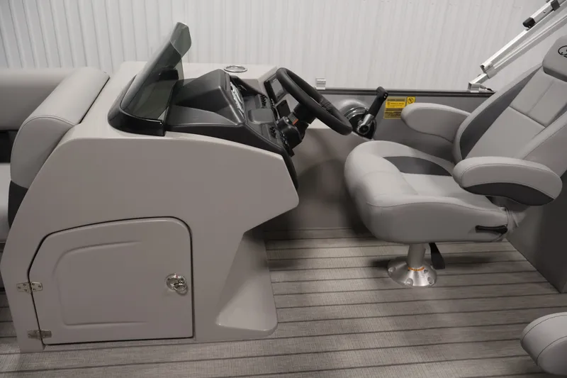 Slide: The Image of 2026 Bentley Pontoons 220 Navigator helm with modern steering and comfortable seating. - 19