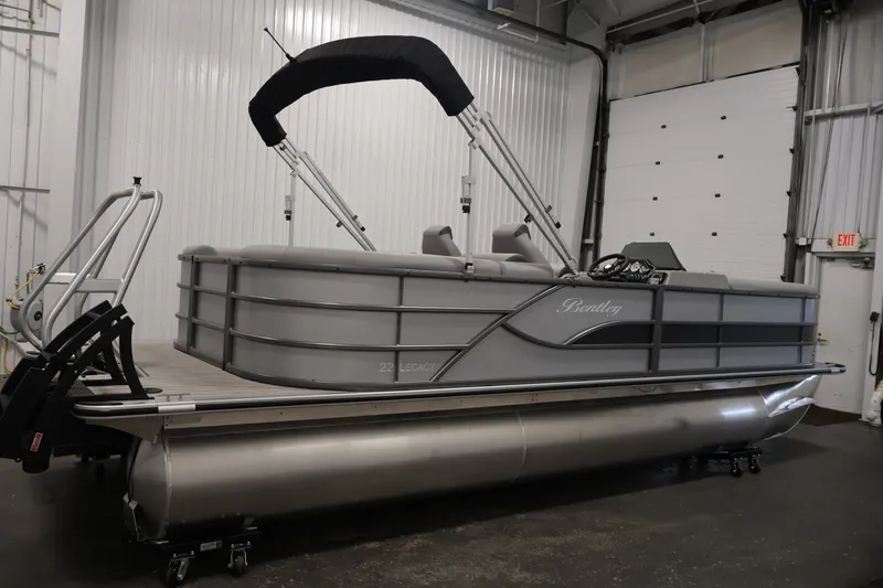 Slide: The Image of 2026 Bentley Pontoons 220 Navigator pontoon boat in a showroom setting. - 6