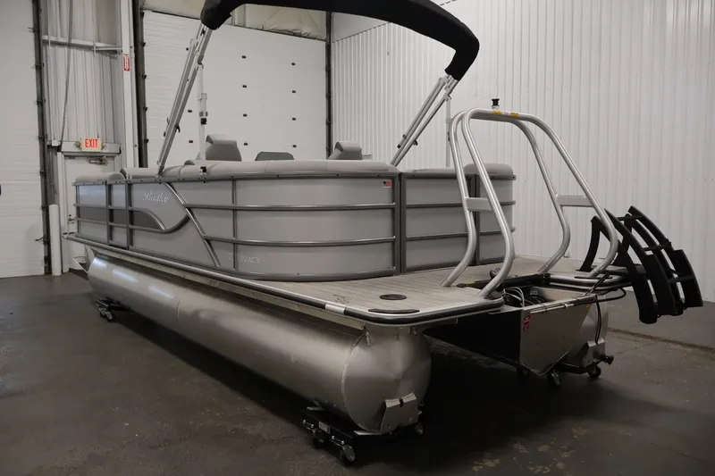 Slide: The Image of 2026 Bentley Pontoons 220 Navigator in a showroom, showcasing sleek design and modern features. - 9