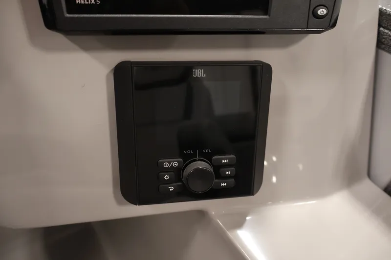 Slide: The Image of JBL audio control panel on 2026 Bentley Pontoons 220 Navigator boat dashboard. - 27