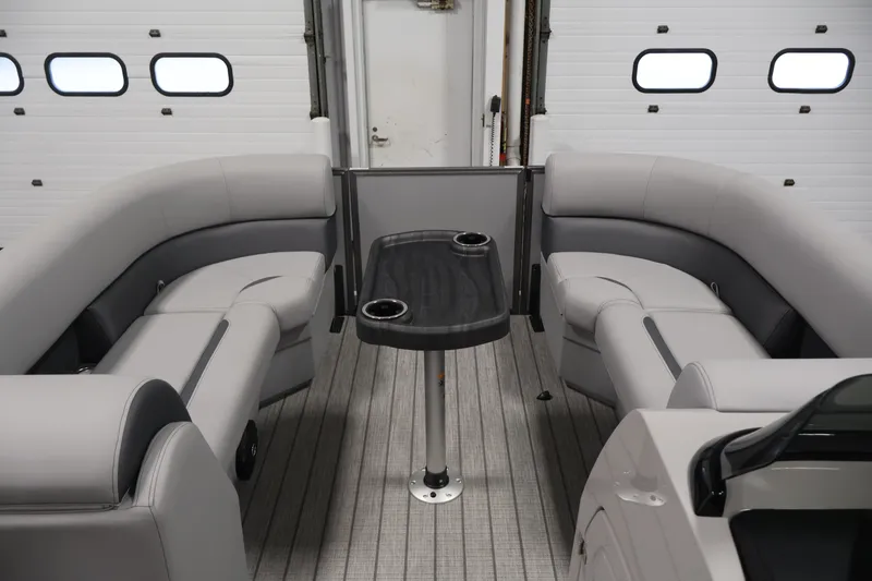 Slide: The Image of 2026 Bentley Pontoons 220 Navigator interior with gray seating and central table. - 13