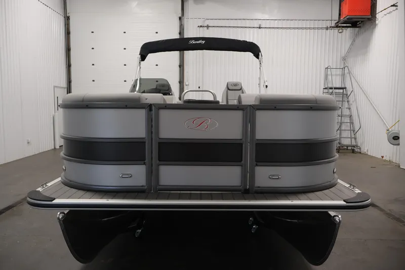 Slide: The Image of 2026 Bentley Pontoons 220 Navigator in a showroom, showcasing sleek design and modern features. - 4