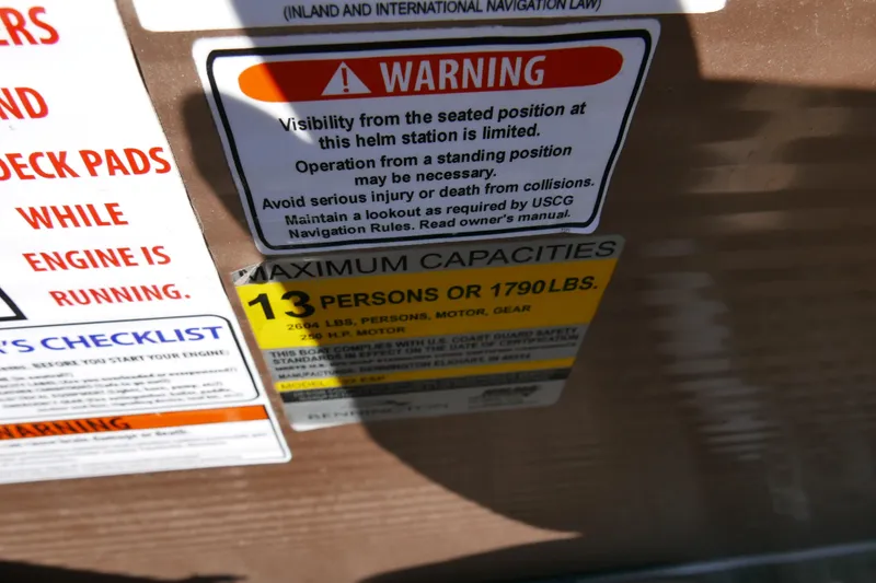 Slide: The Image of Warning and capacity labels on a 2016 Bennington 2250GSR boat. - 12