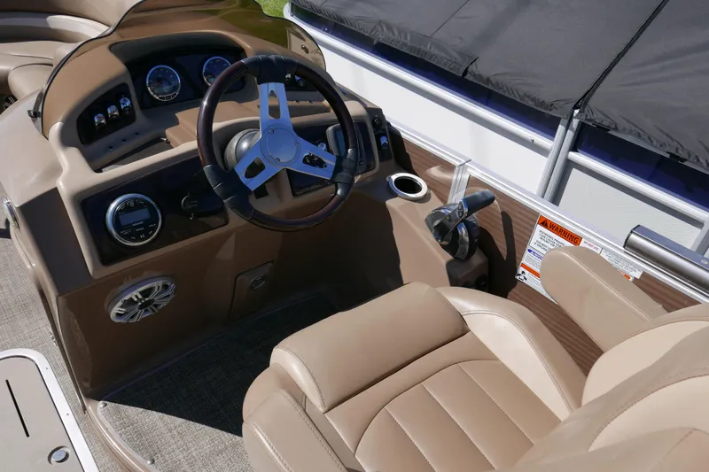 Slide: The Image of 2016 Bennington 2250GSR boat interior with steering wheel and control panel. - 8