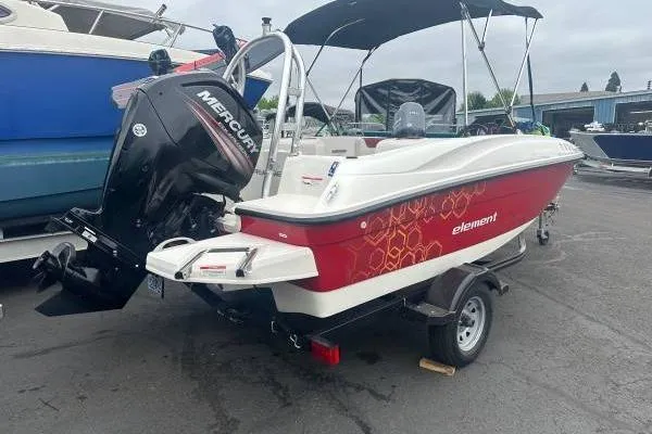 Slide: The Image of 2016 Bayliner 160 Element boat with Mercury engine, parked on a trailer. - 3
