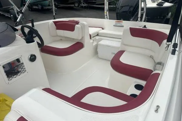 Slide: The Image of 2016 Bayliner 160 Element boat interior with red and white seating. - 5